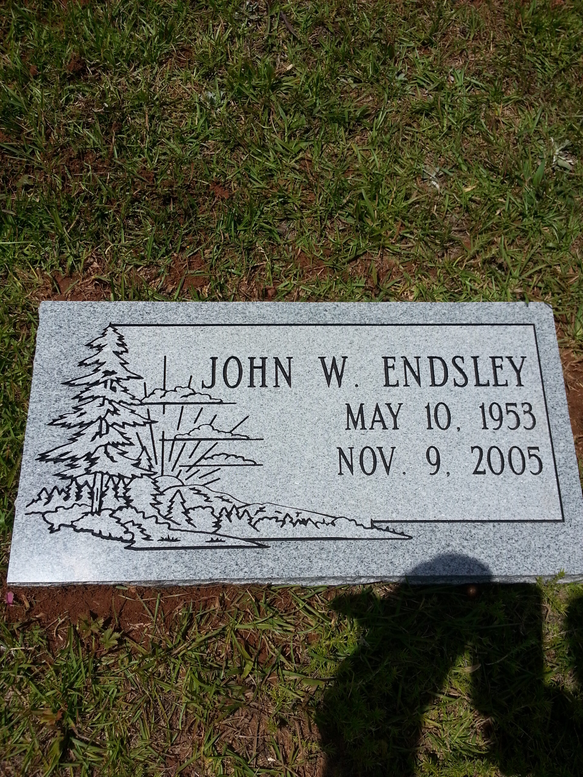 flat marker with engraved forest scene