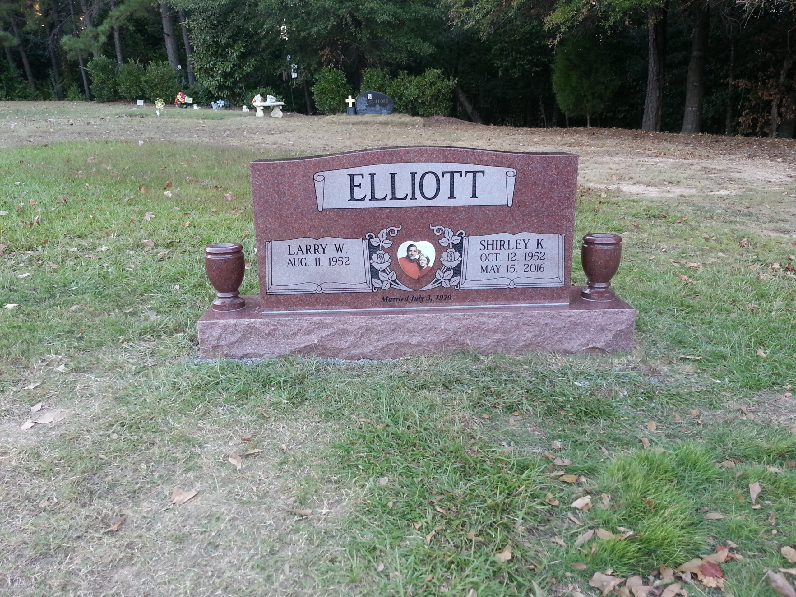 pink granite companion memorial with vases
