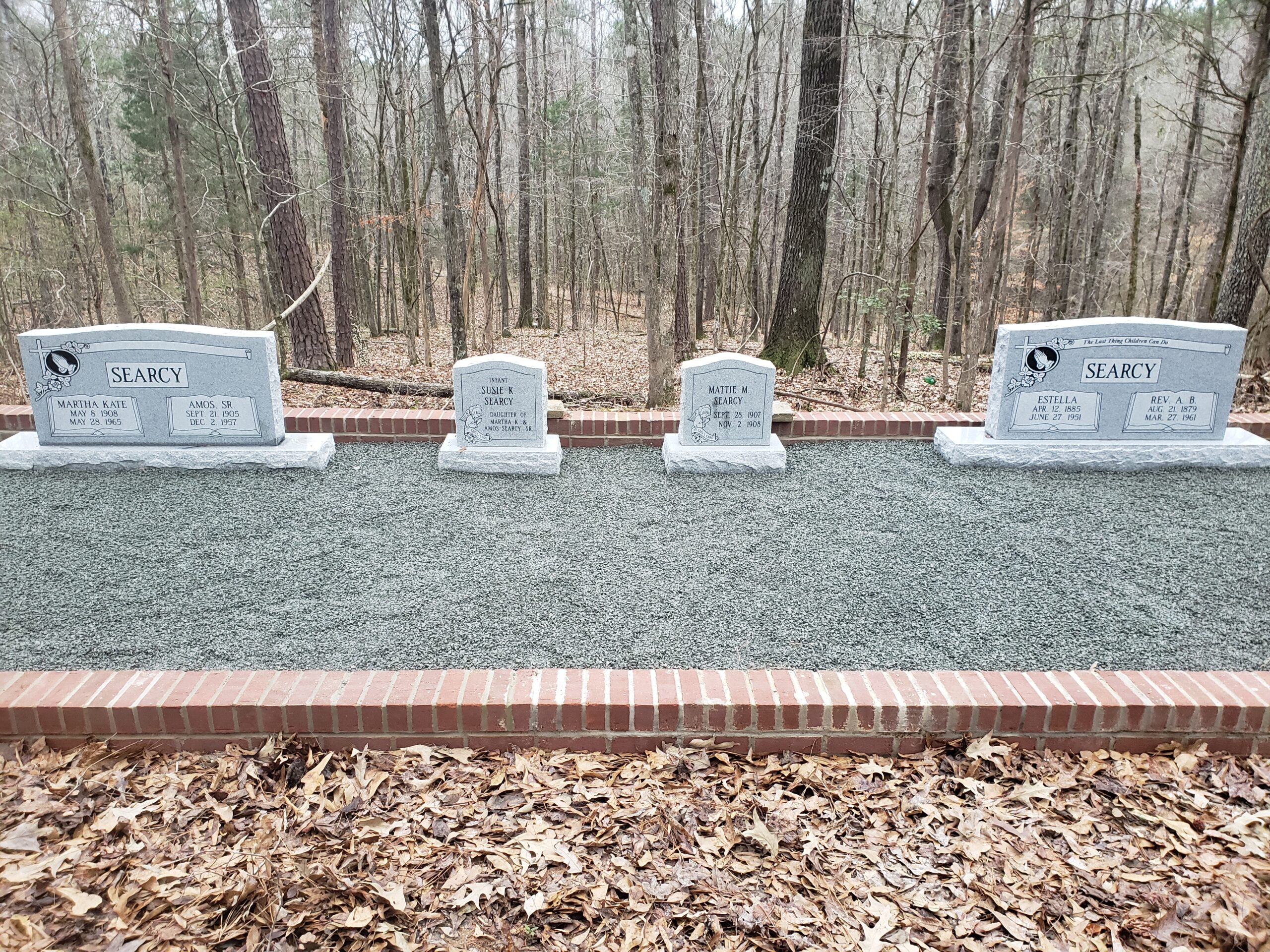 family plot with companion and single headstones