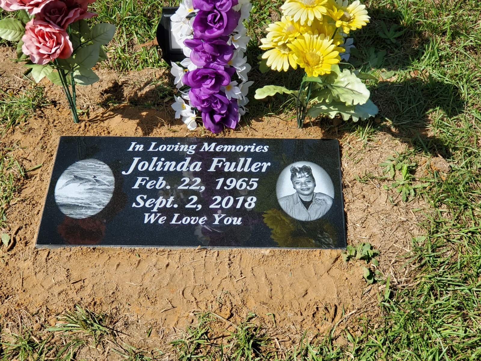 flat headstone with photo engravings