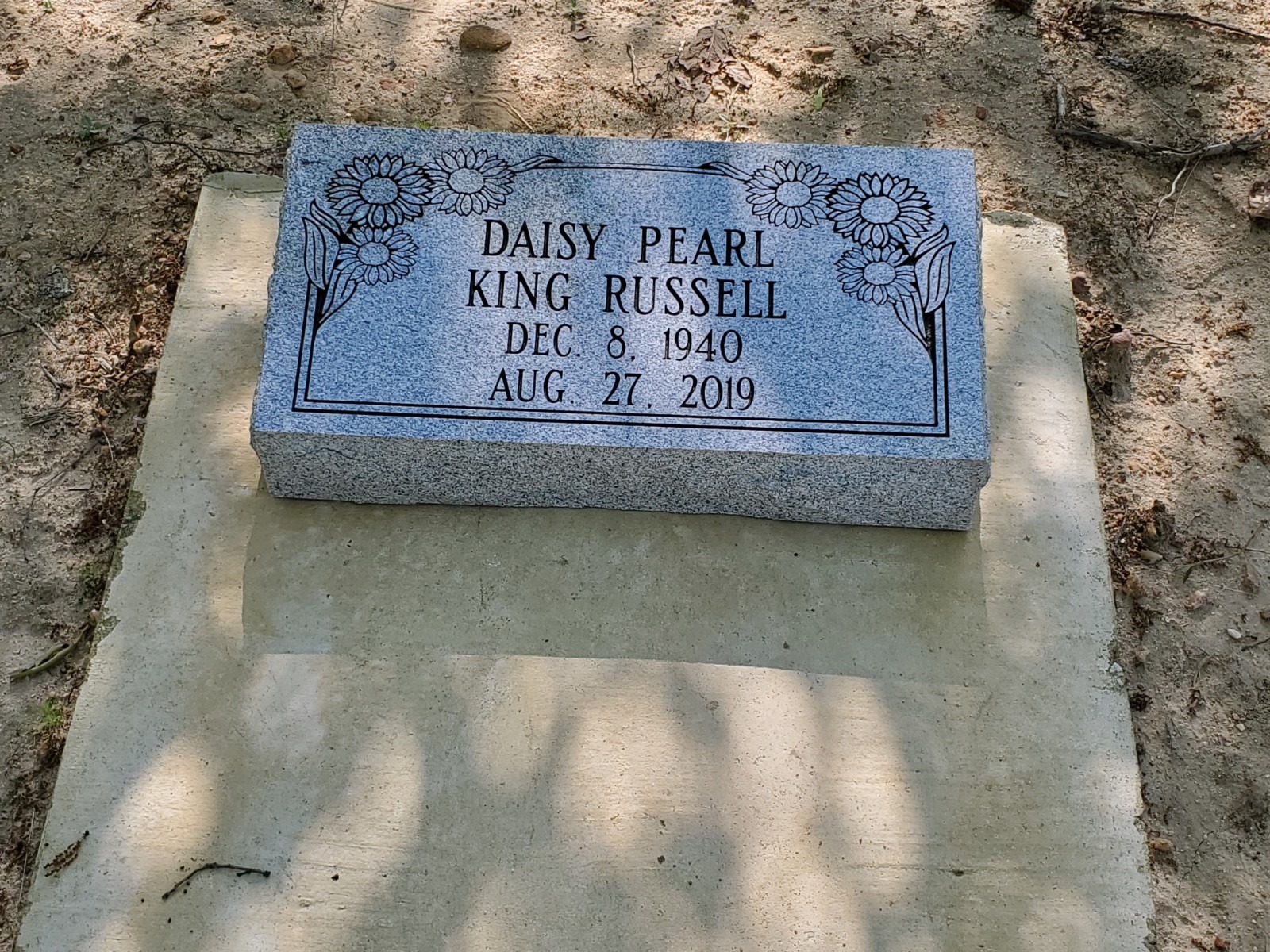bevel monument with floral engraving