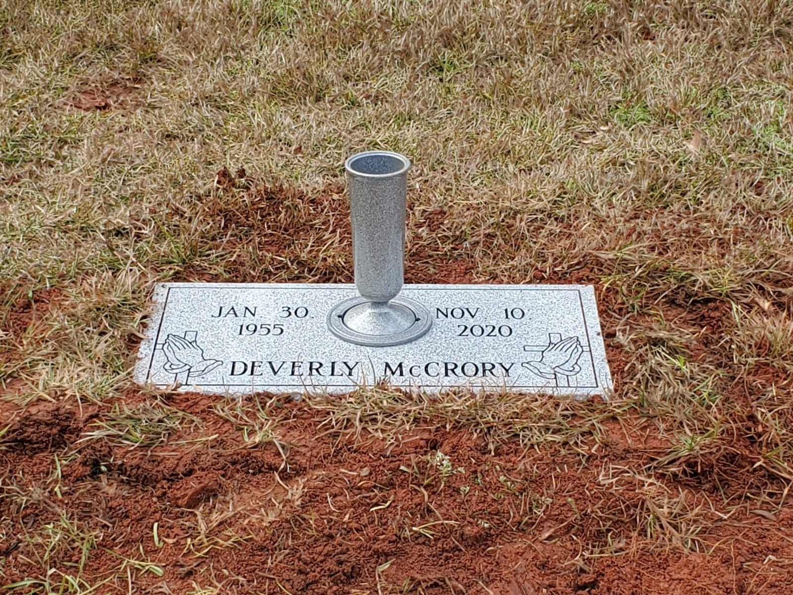 flat grey granite headstone with vase