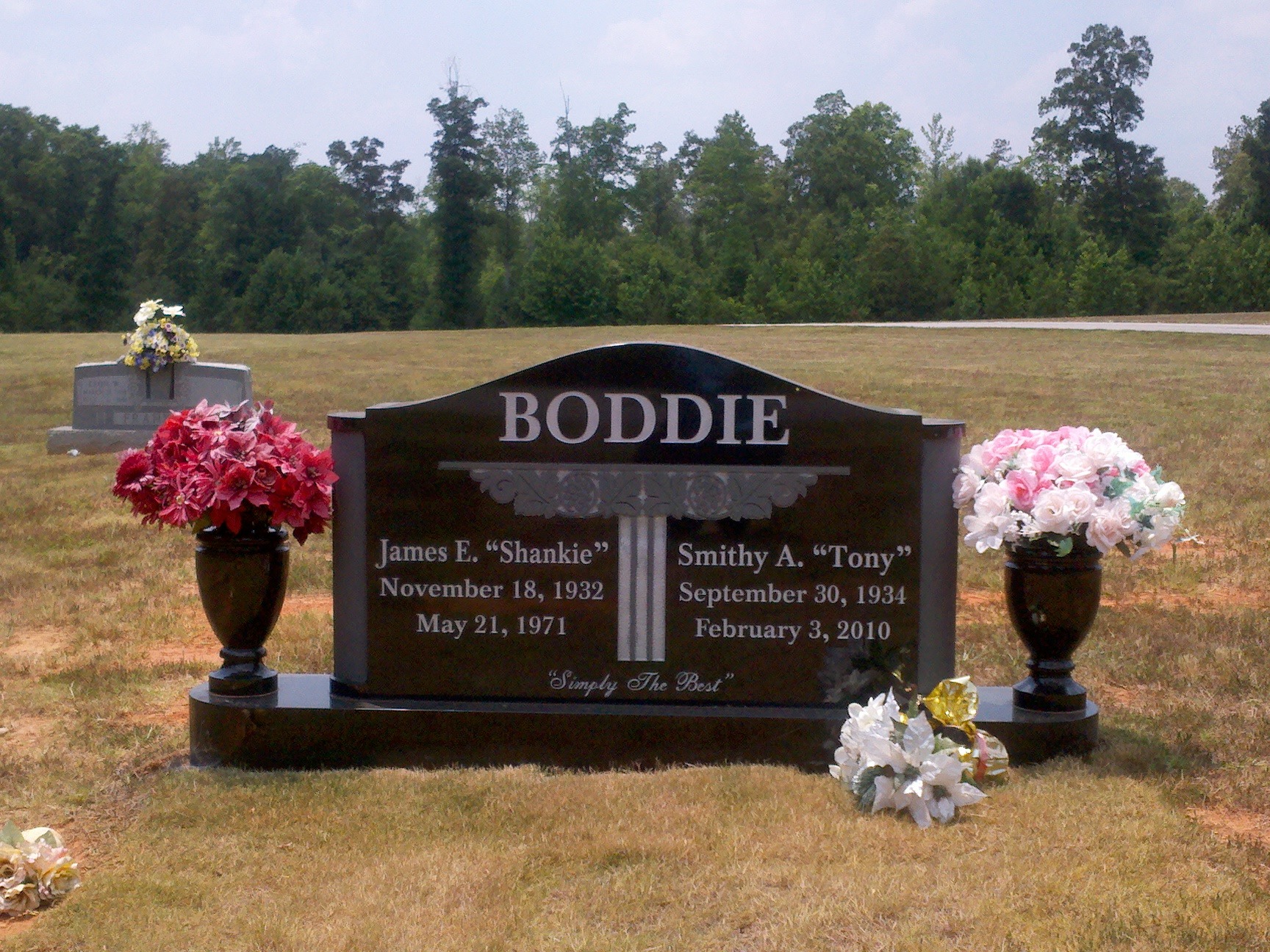 black granite companion monument with vases
