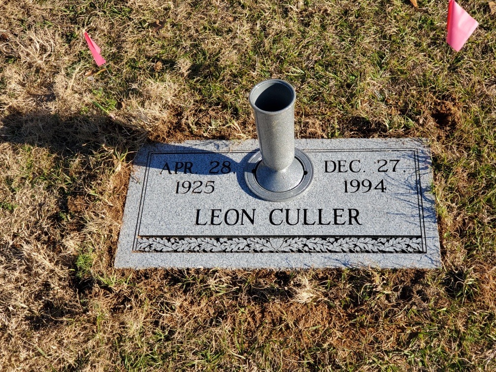 flat headstone with vase