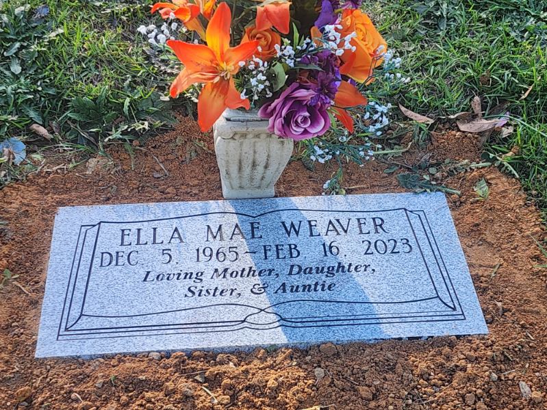 flat headstone with vase