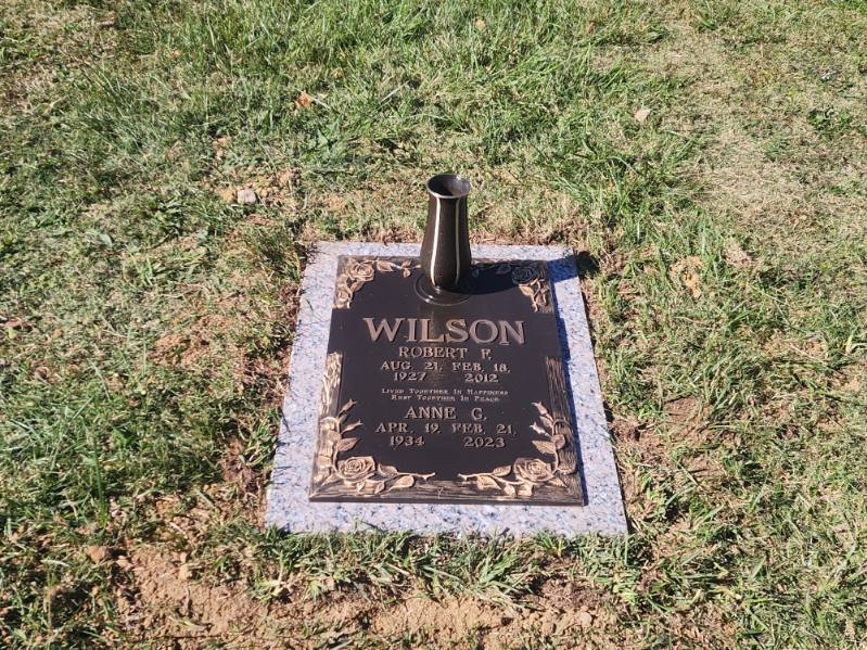 double bronze grave marker with vase