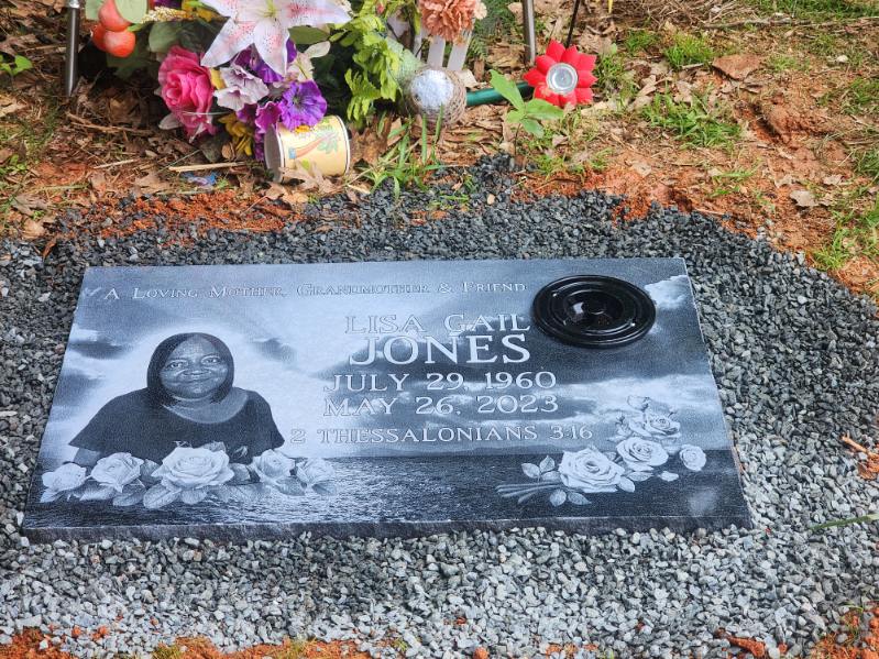 flat headstone with engraved photo